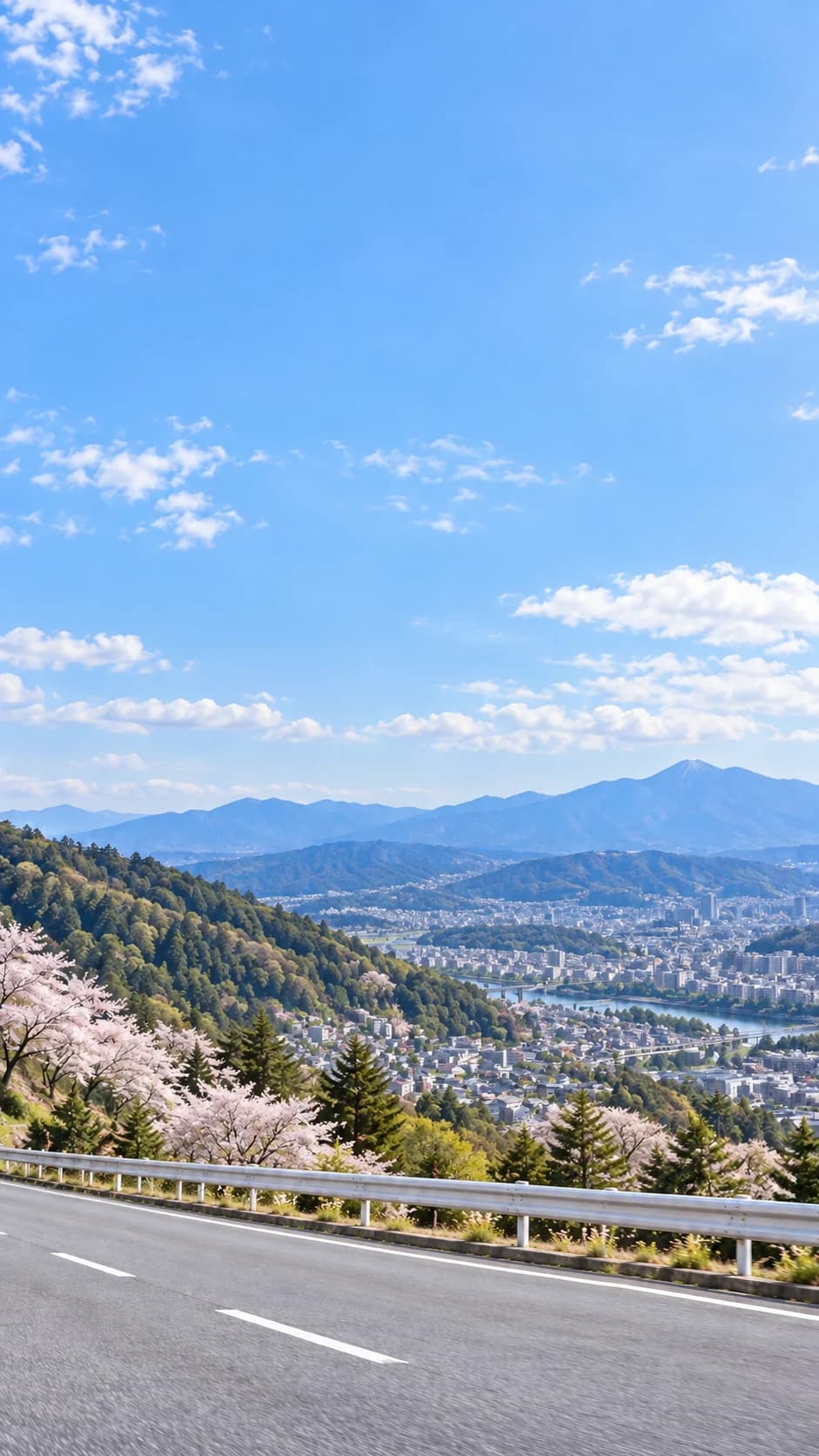 青空と山並みと道路のイメージ